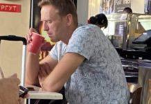 Vladimir Putin’s now gravely ill arch rival Alexei Navalny pictured drinking ‘poisoned’ tea at Tomsk airport