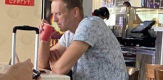 Vladimir Putin’s now gravely ill arch rival Alexei Navalny pictured drinking ‘poisoned’ tea at Tomsk airport